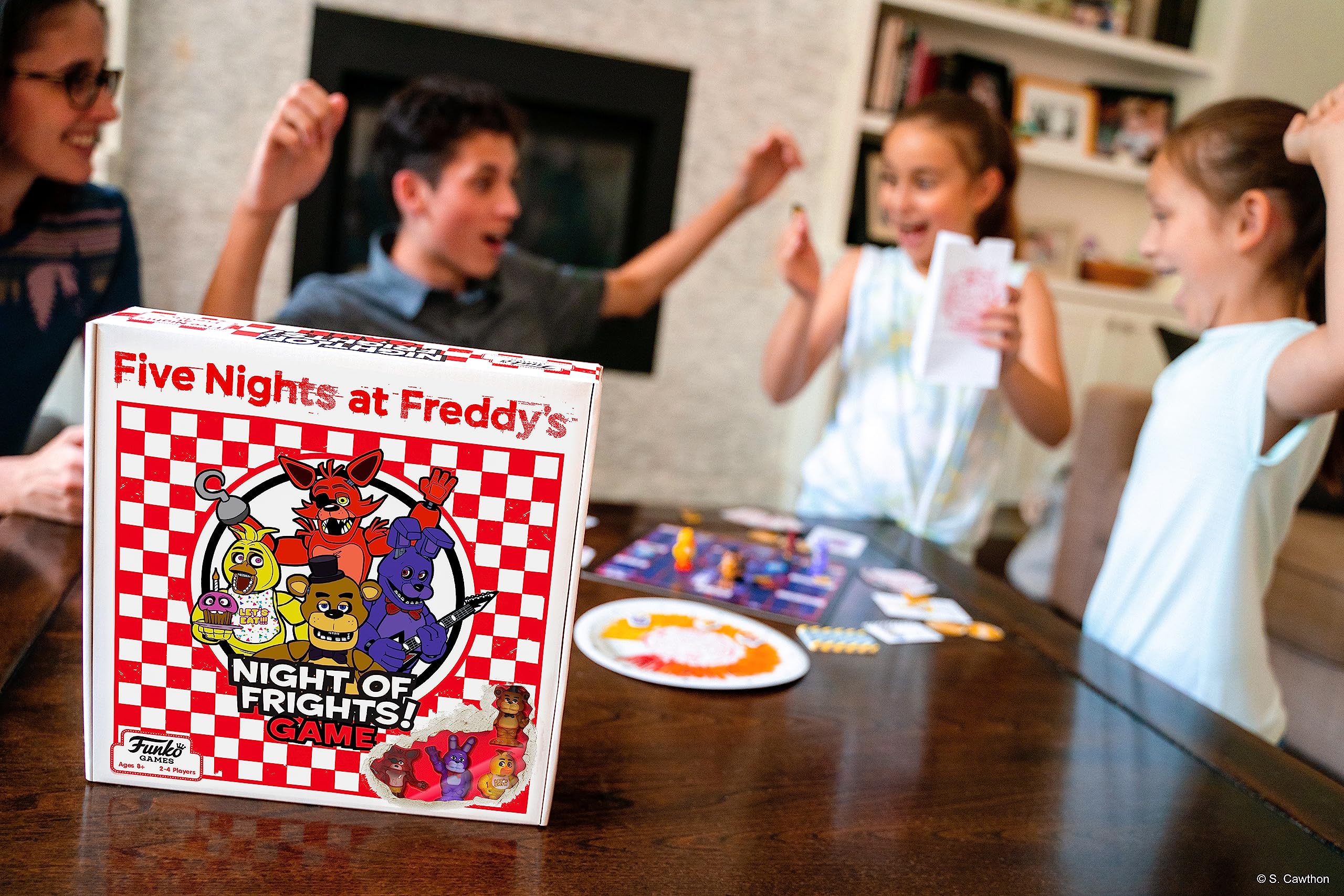 Night-time play scene featuring Funko Games Night of Frights board.