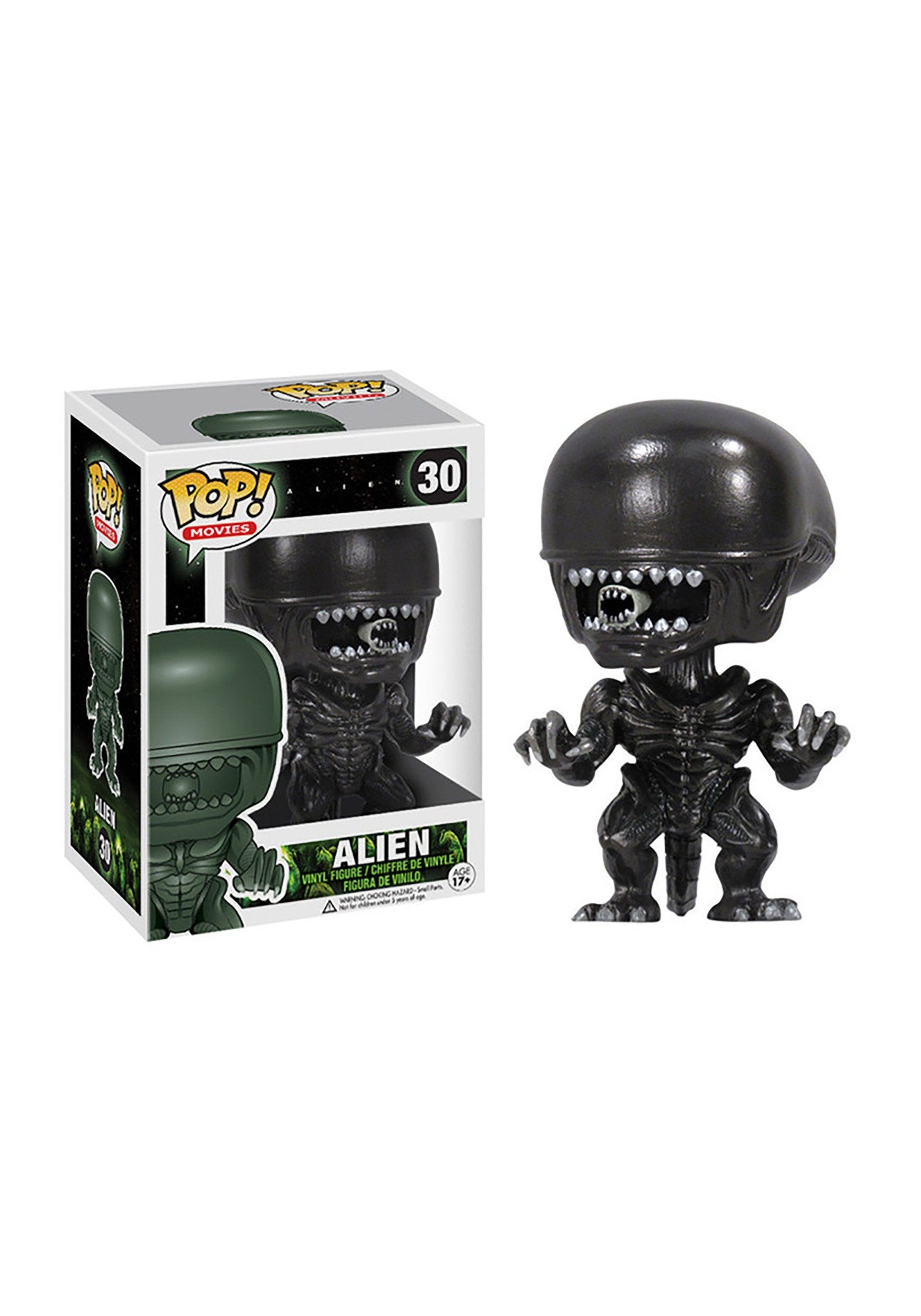 Funko Pop Movies Alien figure on a display shelf, ideal for collectors.