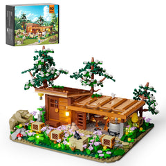 FUNWHOLE Bee-Farm cabin-front view with cozy display lighting.