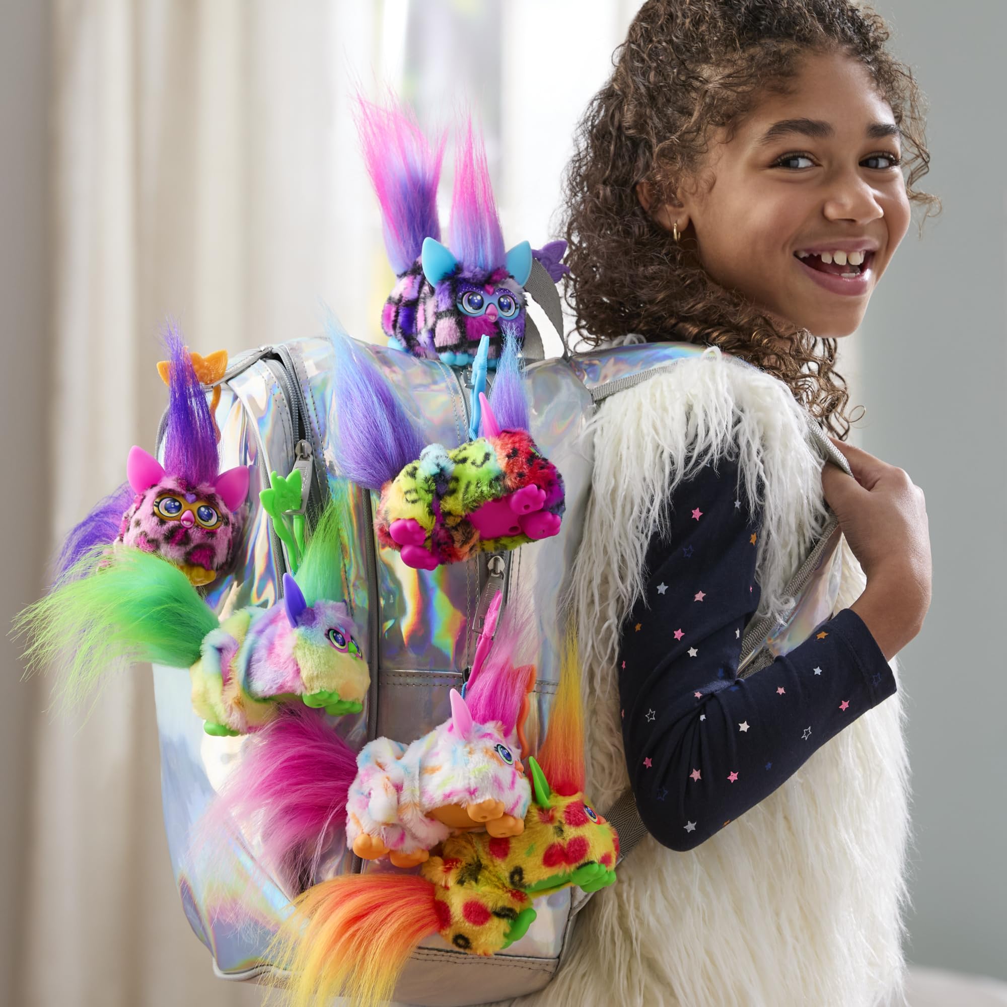 Furby DJ Furblets clip-on-bag shows portable travel-friendly toy for on-the-go fun.