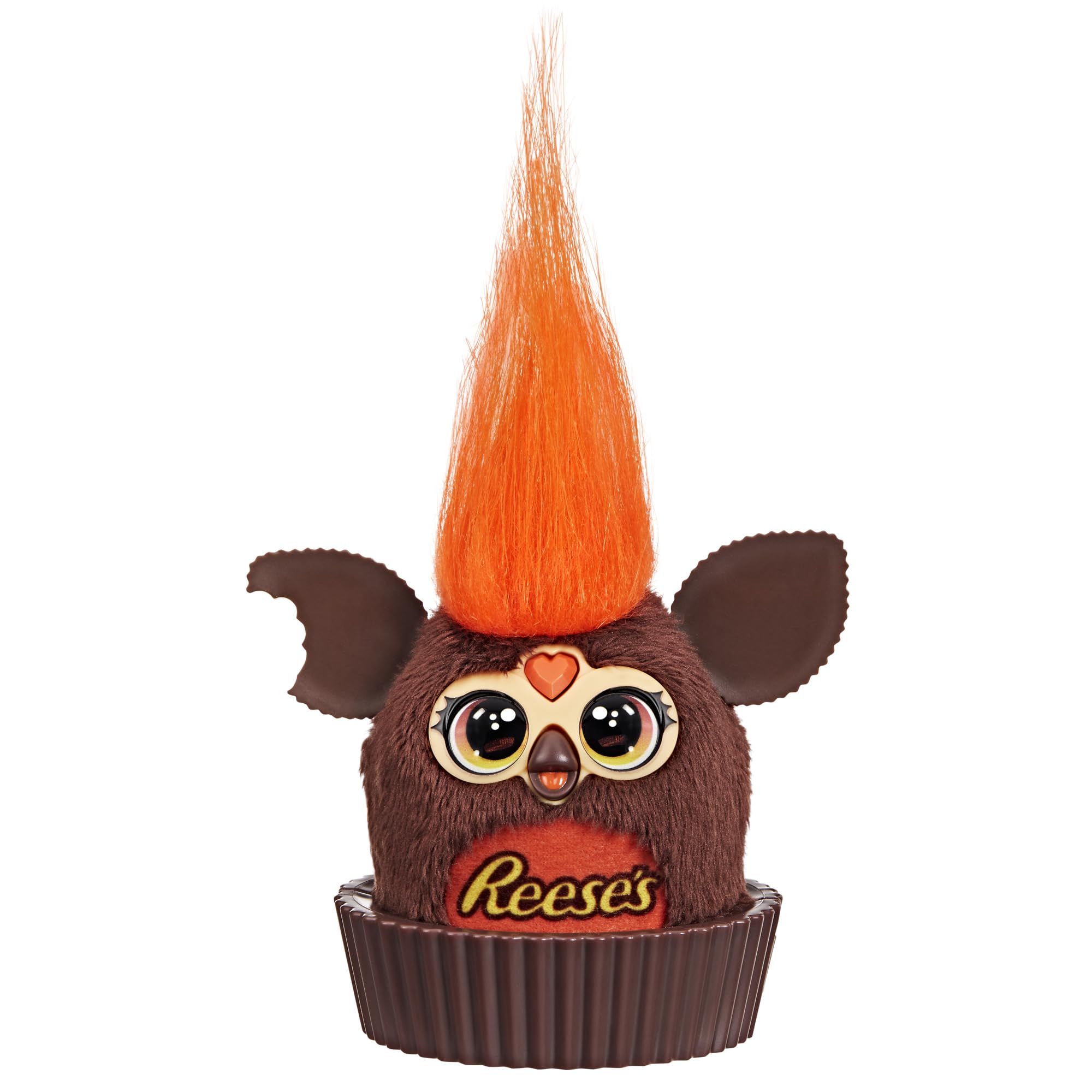 Furby Furblets Reese's cup display sits on a desk for playful decor.