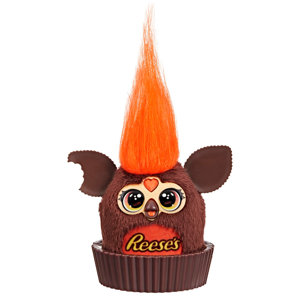 Furby Furblets Reese's cup display sits on a desk for playful decor.