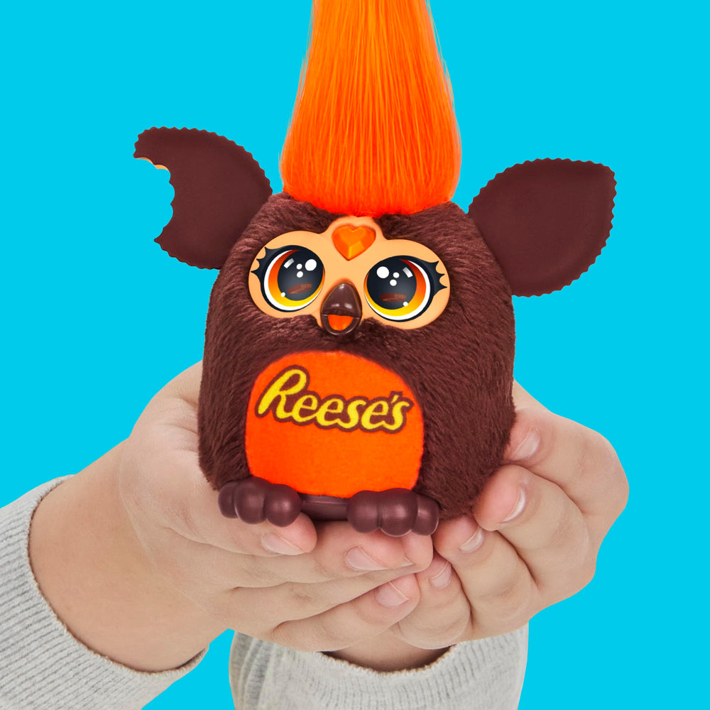 Furby Furblets wiggle ears candy-inspired charm during pretend play.