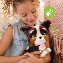 FurReal Bernedoodle next to child’s hand for scale and easy portability