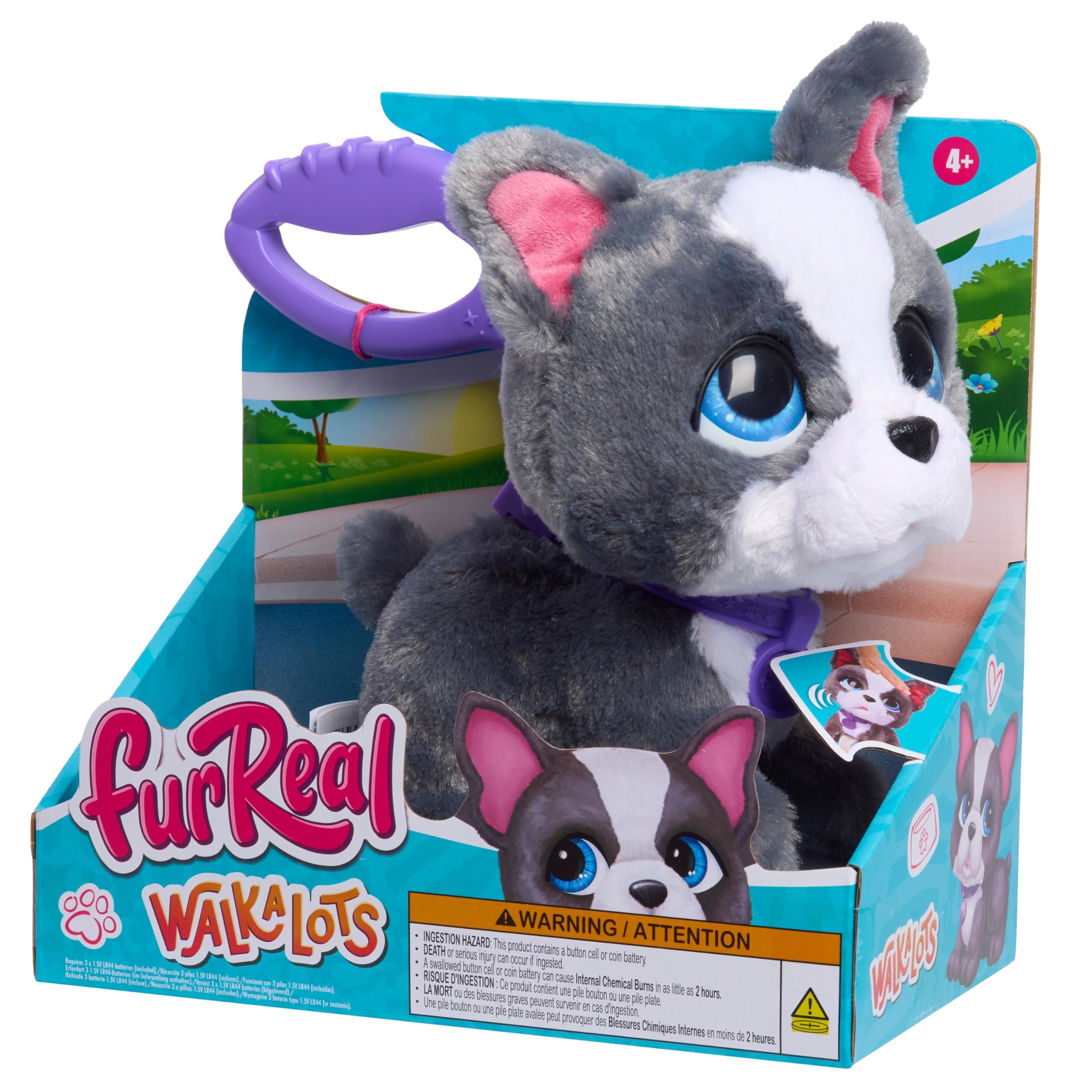 FurReal French Bulldog beside child hand for scale to show child-friendly size