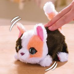 FurReal My Minis kitty inside a child's backpack for scale and travel-friendly convenience