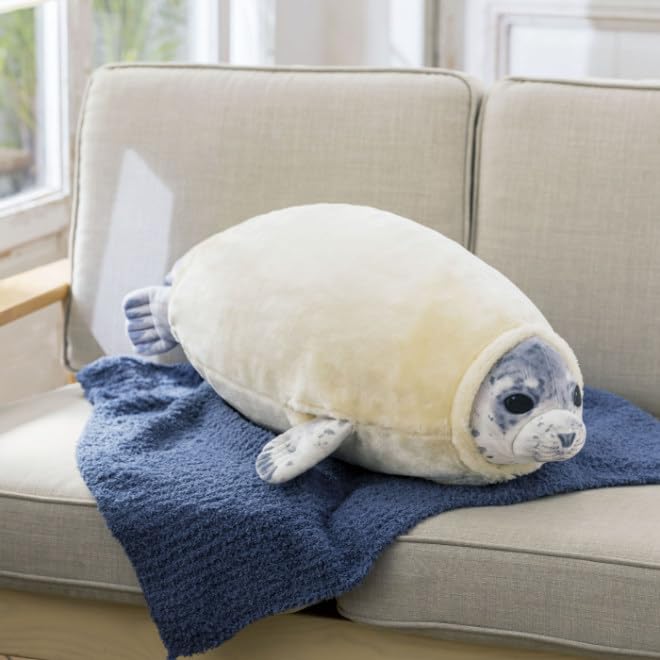 Furvana seal pillow in bedroom decor, adds playful charm to the space.
