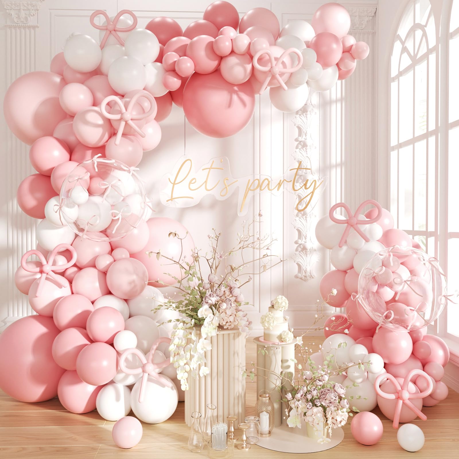 Futureferry pink and white balloons arch kit set up for a festive photo backdrop.