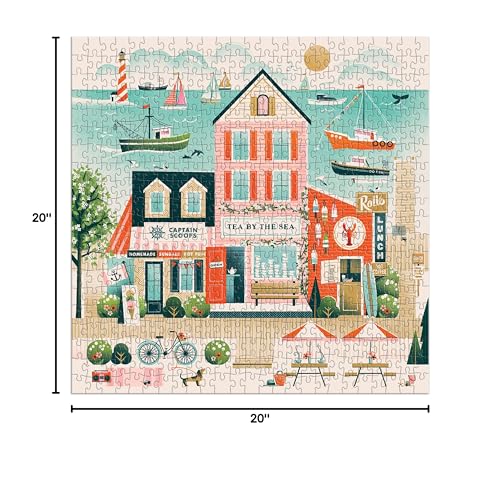 Galison Beside The Sea puzzle design showcases bold pastel tones and village scenery.