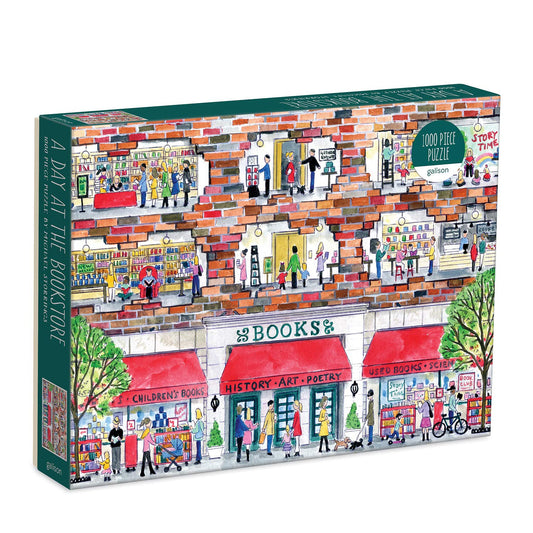 Galison Michael Storrings puzzle box cover shows a cozy bookstore scene perfect for quiet evenings