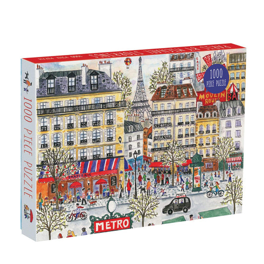 Galison Michael Storrings Paris puzzle box art shows a sunny city scene, perfect for family puzzle nights.