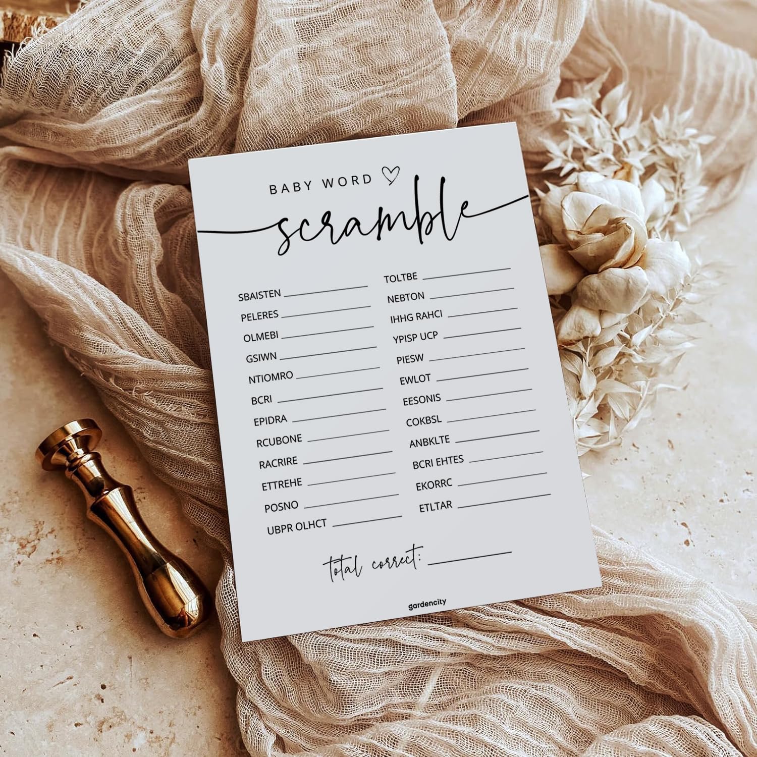 GardenCity 50 Baby Shower Word Scramble Cards on table during party for shared laughter