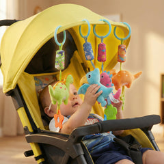 Gebra four-piece dinosaur teether set clipped for arches and mats