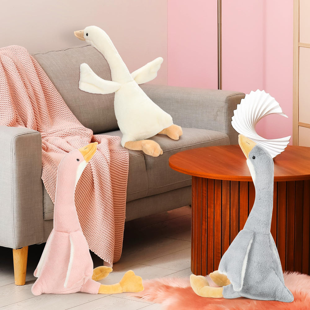 Goose plush on a bed, perfect as a sleeping companion.