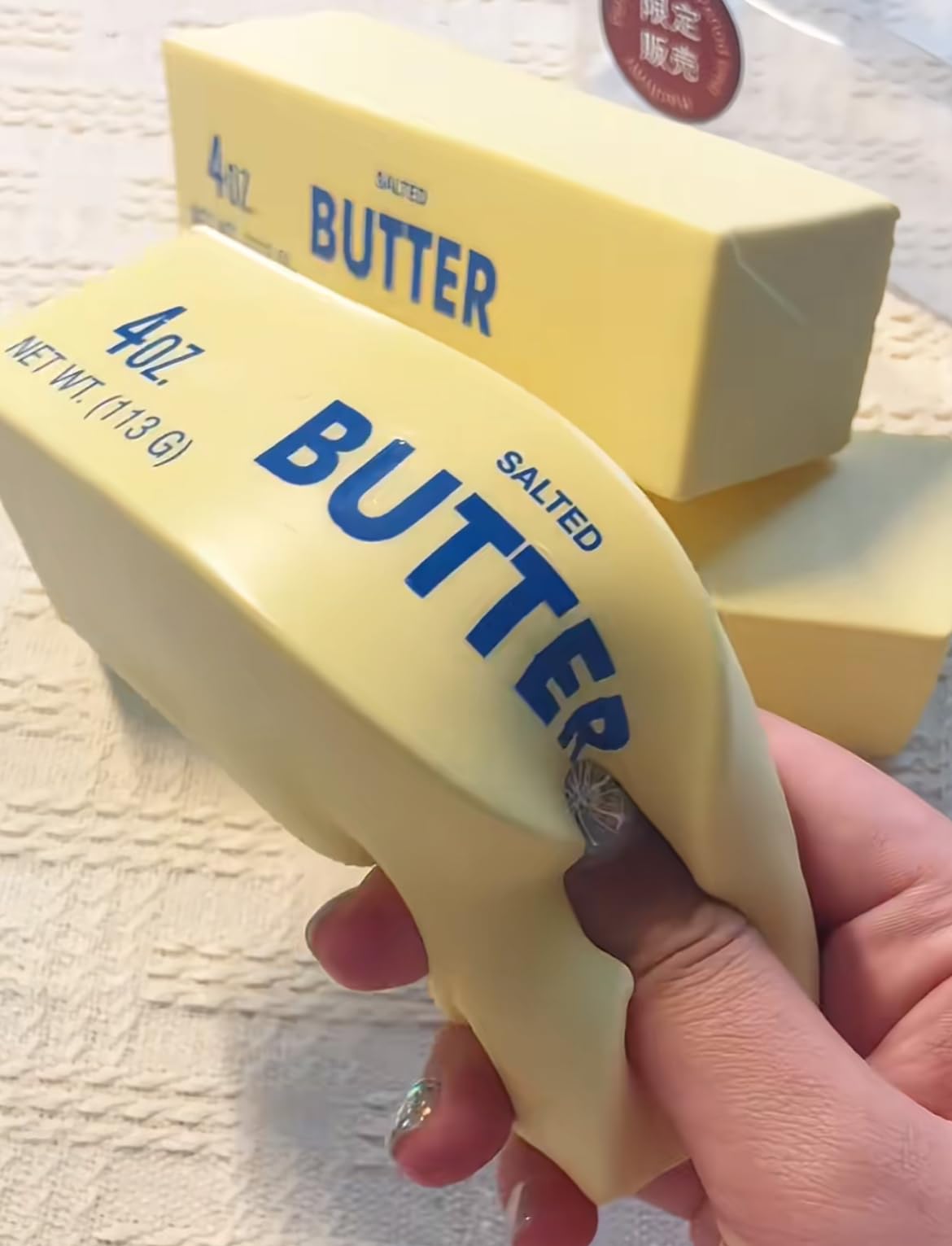 Generic slow rising squishy butter-stick 3pcs on desk for stress relief and focus