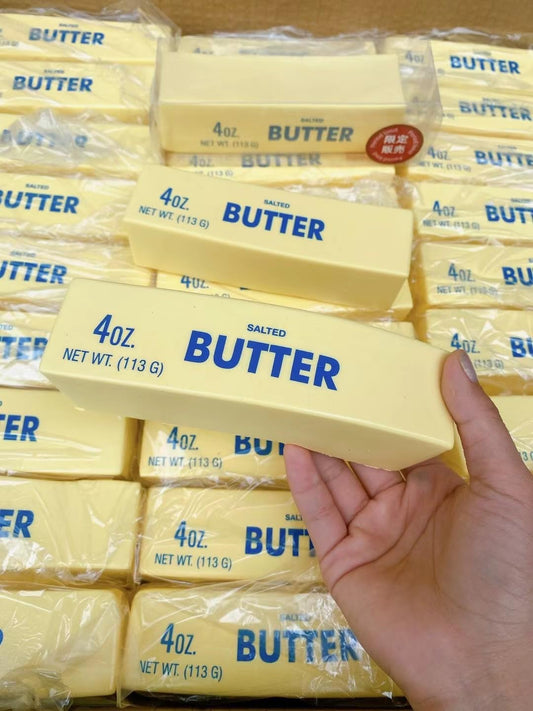 Generic butter-stick squishy in hand promotes calm during work or study