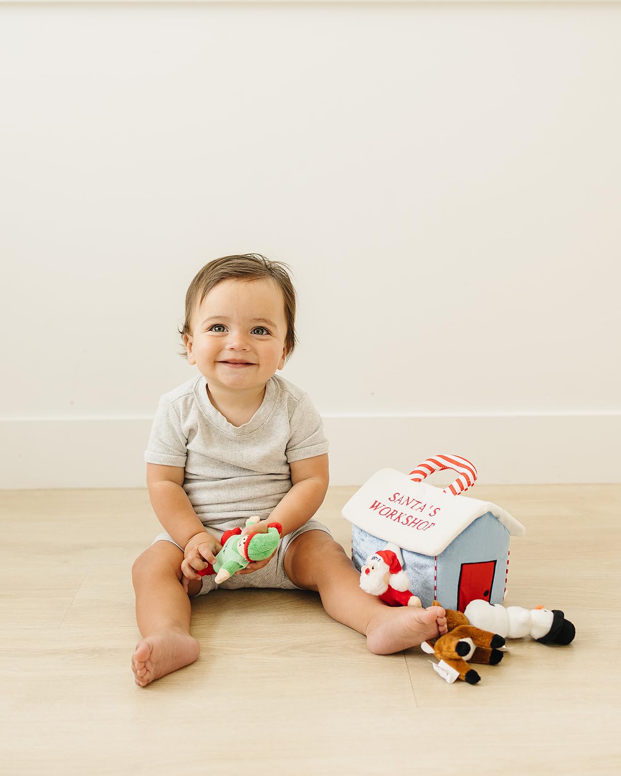 Genius Baby Toys My First Christmas Elf plush offers easy grasp and holiday themed tactile play.