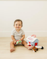 Genius Baby Toys My First Christmas Elf plush offers easy grasp and holiday themed tactile play.