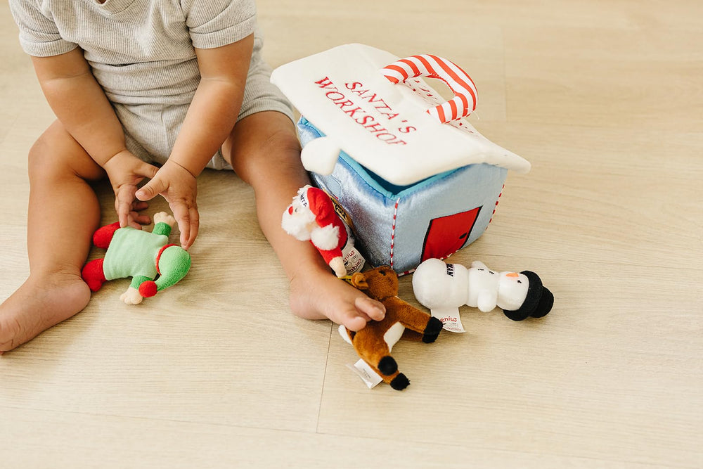 Genius Baby Toys My First Christmas House plush adds cozy appeal to nap and playtime.