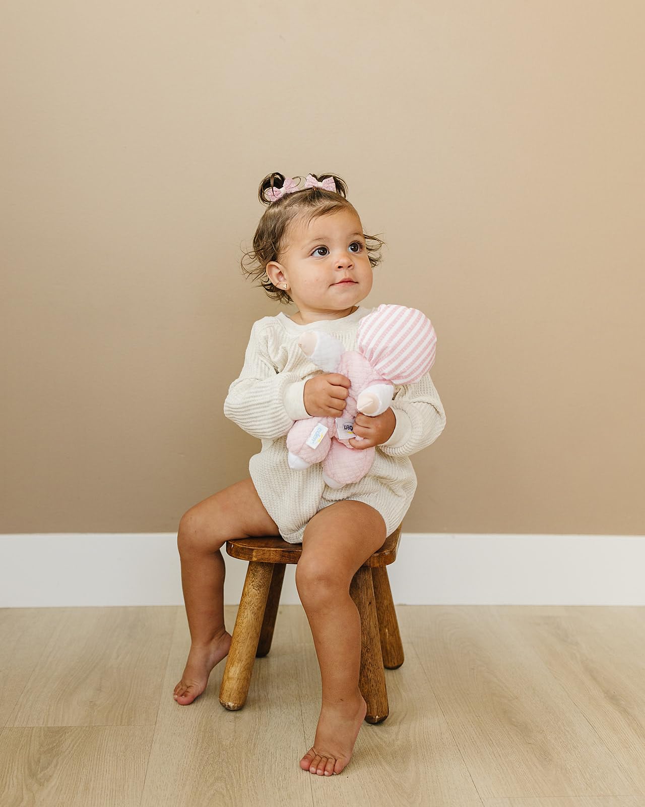 Genius Baby Toys smiling face doll invites gentle interaction and nurture