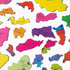 GeoToys GeoPuzzle family playing together to build geography skills
