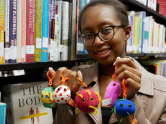 GIANT MICROBES SARS plush keychain for epidemiology fans.
