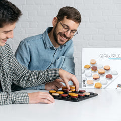 GIGAMIC Qawale mancala-twist explained through strategic gameplay visuals.