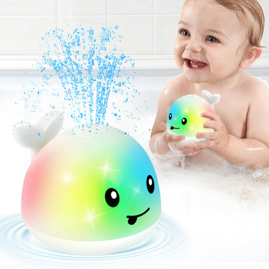 Gigilli whale bath toy sprinkler in water for engaging play.