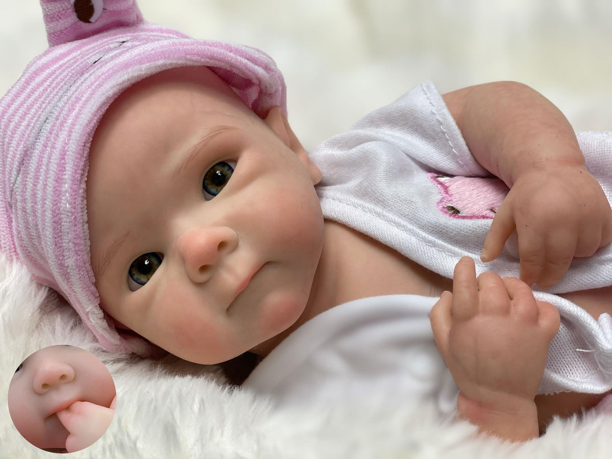 Gileutay 12-inch full silicone doll offers lifelike cuddling and natural pose.
