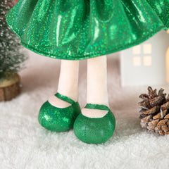 Gloveleya Christmas Baby Doll ornament display enhances holiday ambience