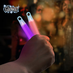 Glow Fever Ultra Bright Glow Sticks illuminate crowds at night.