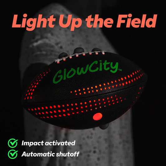 GlowCity glow football lit at night with visible LED glow detail.