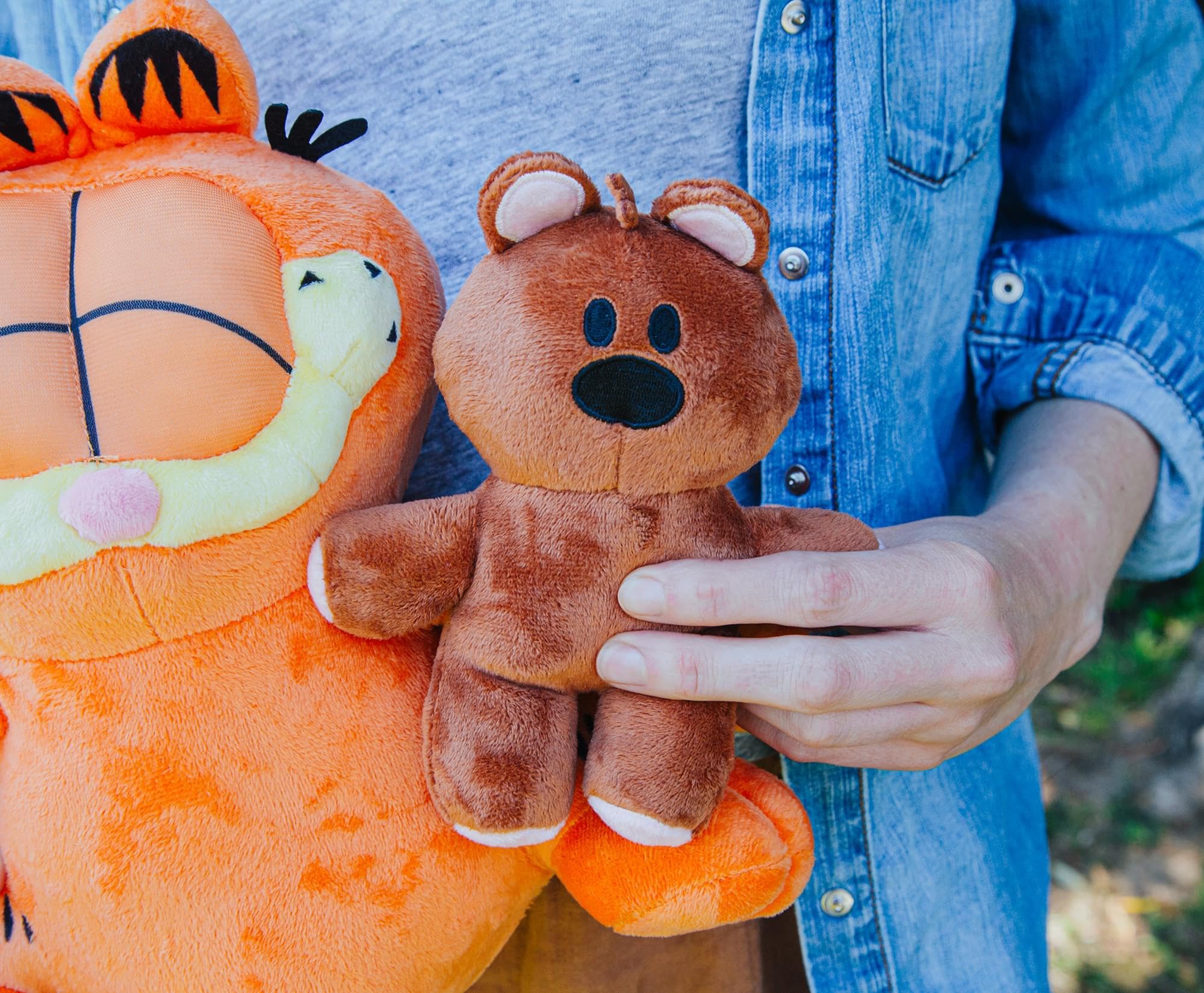 Golden Bell Garfield plush features durable stitching for daily cuddles.