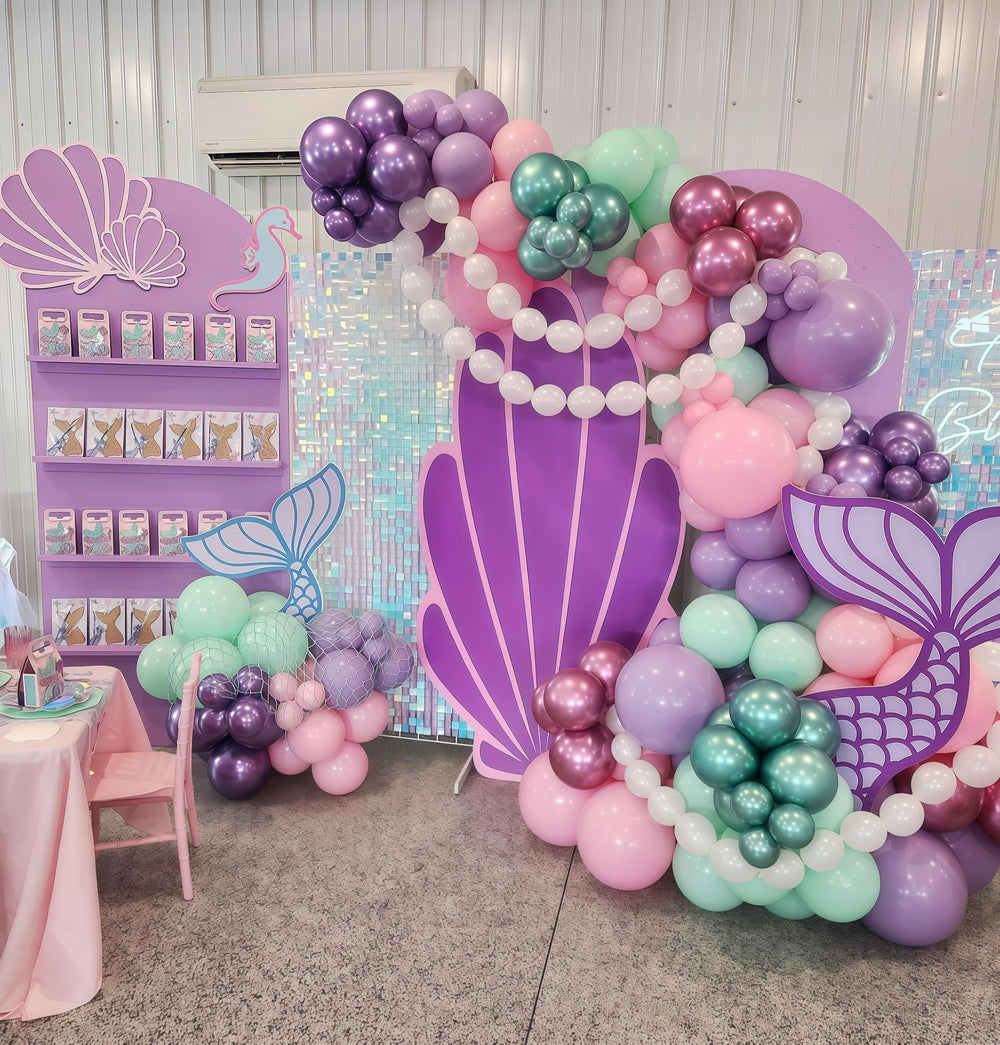 Govpy baby shower accents using pearl white linking balloons for chic decor.