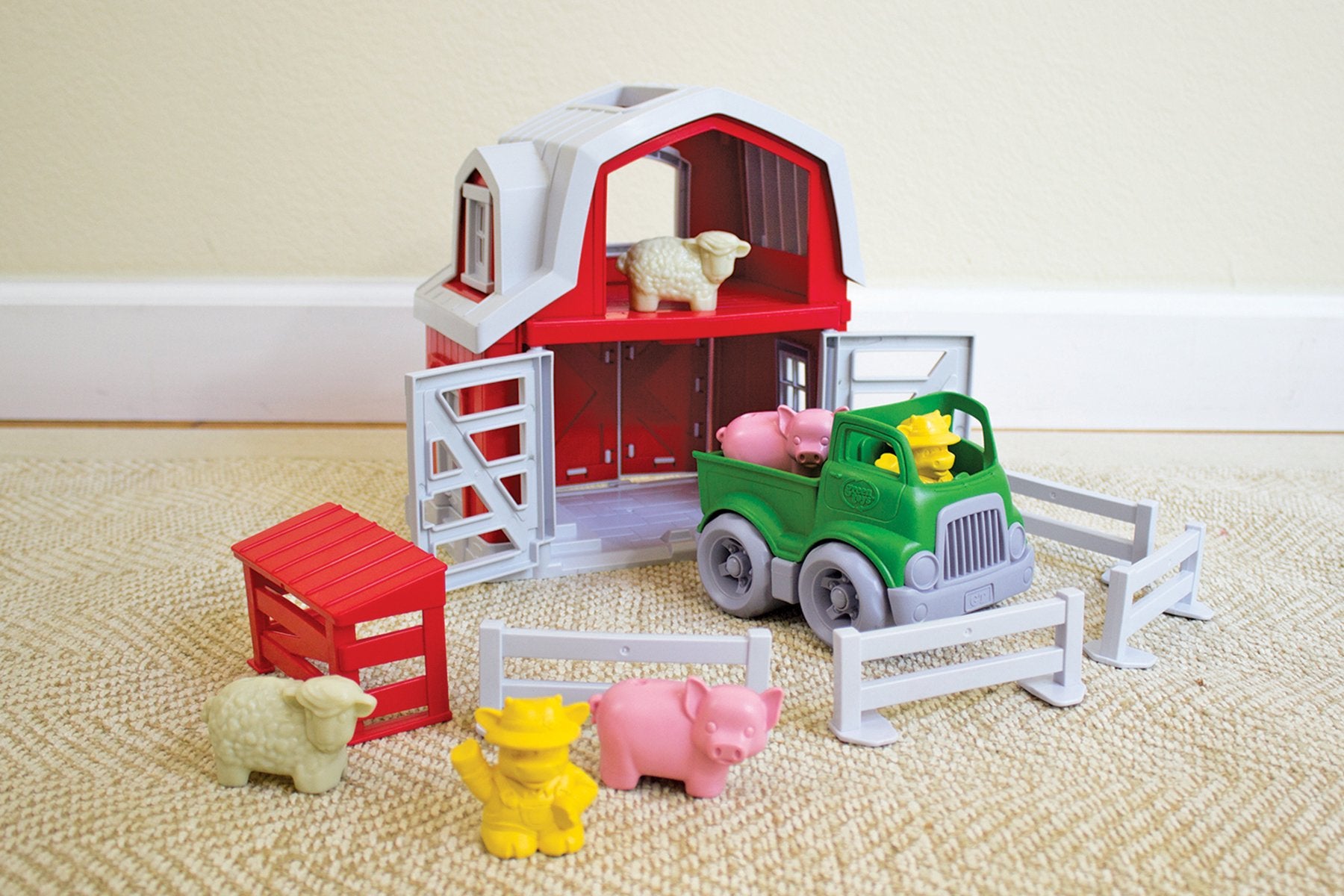Green Toys Farm Playset fences create structured spaces for organized play