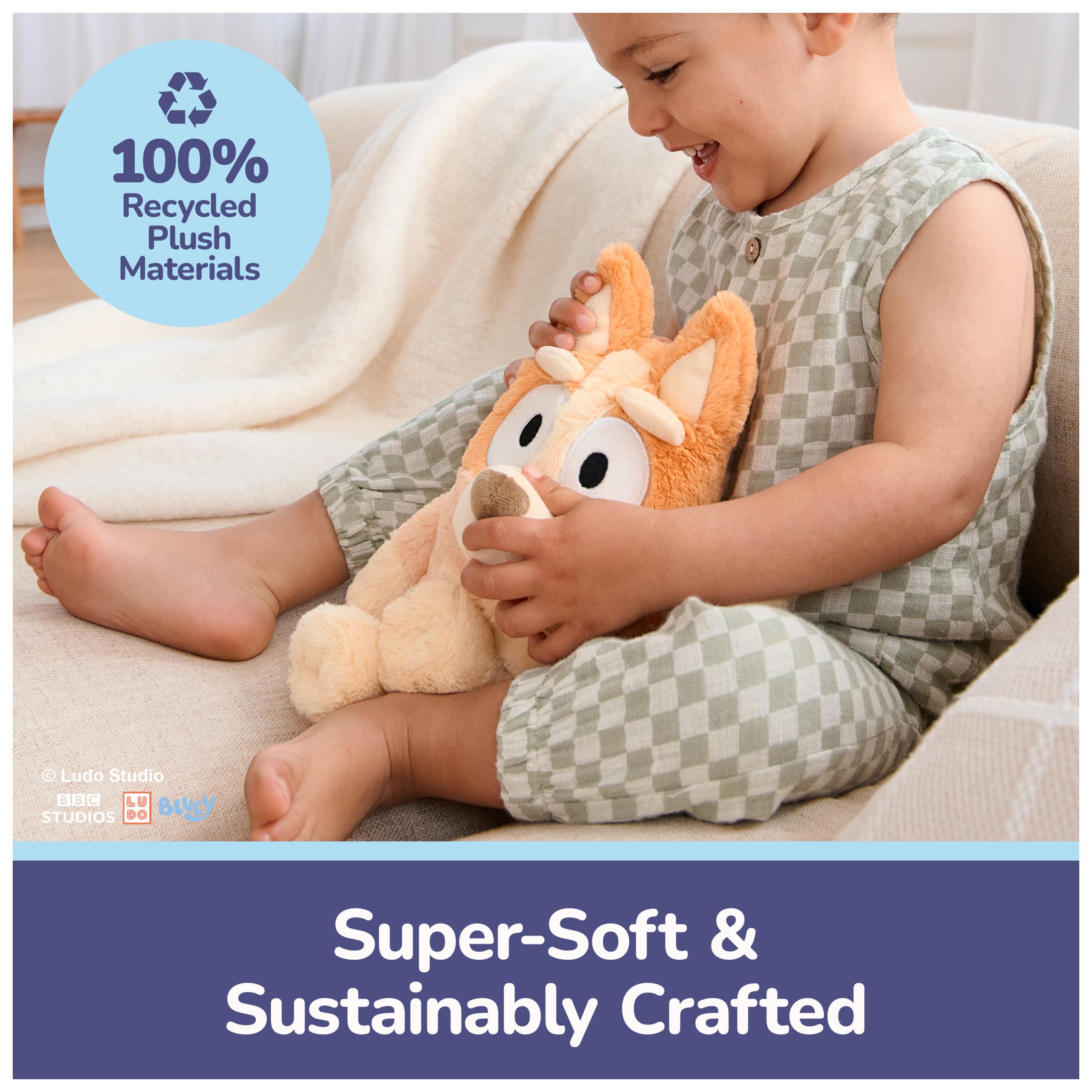GUND Bingo pastel orange plush close-up with friendly embroidered smile.