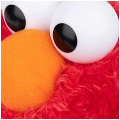 GUND Elmo face with bright eyes detail highlighting authenticity.