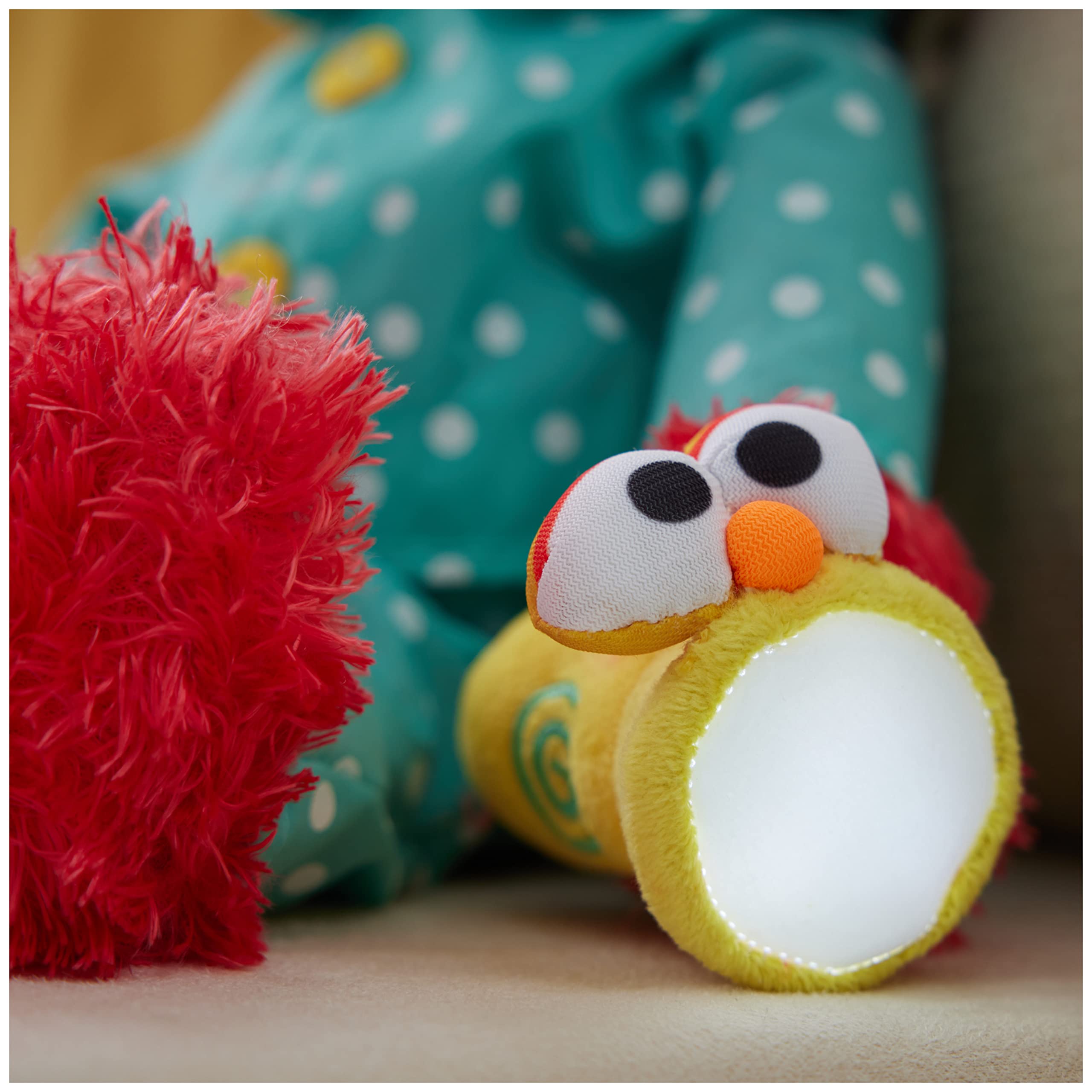 GUND Elmo with press-activated LED flashlight provides gentle illumination during bedtime.