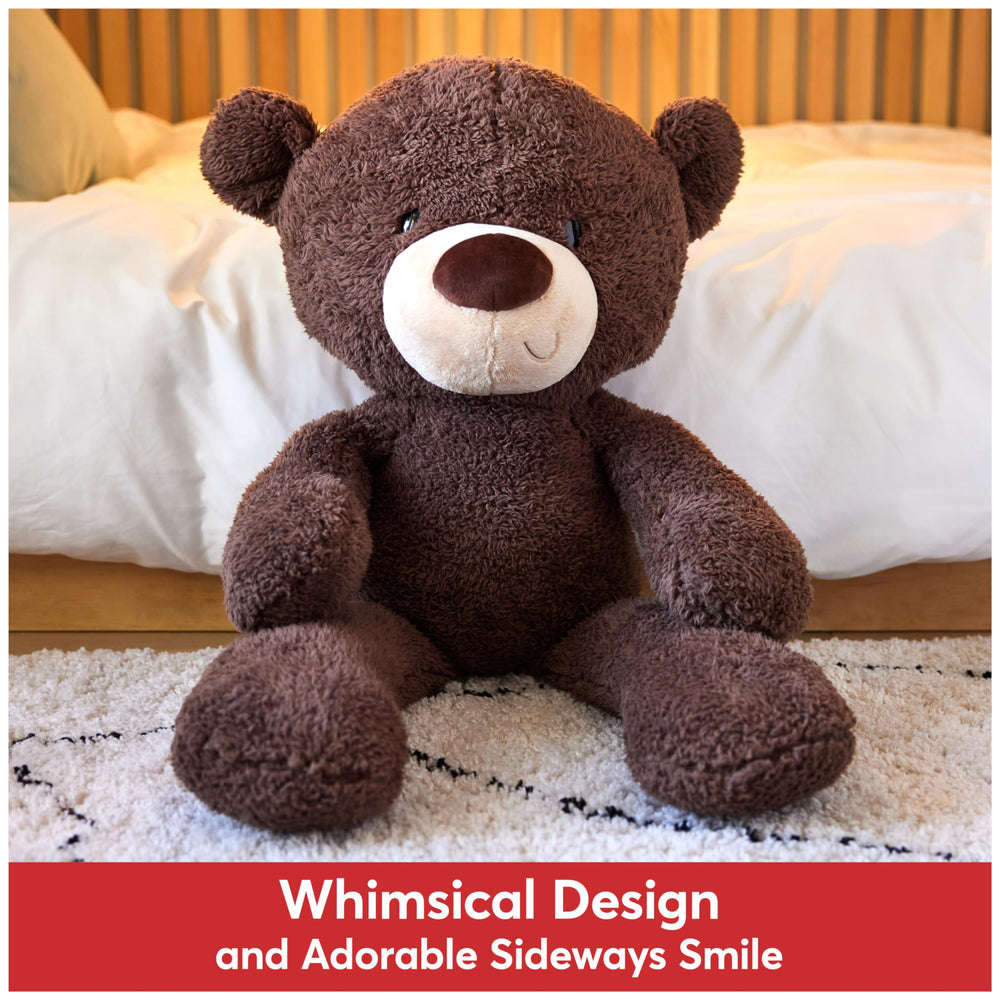 GUND Fuzzy teddy bear side view with floppy arms for easy hugging.