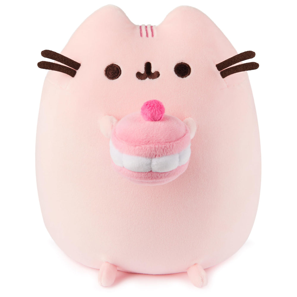 GUND Pusheen Cherry Macaron Squisheen plush holding a macaron for cozy play.