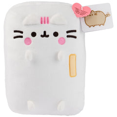 GUND Pusheen kitchen plush on desk, adding cute charm to any space.