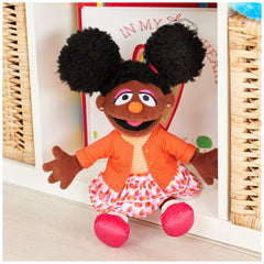GUND Gabrielle outfit highlight featuring orange cardigan and striped top for colorful play.
