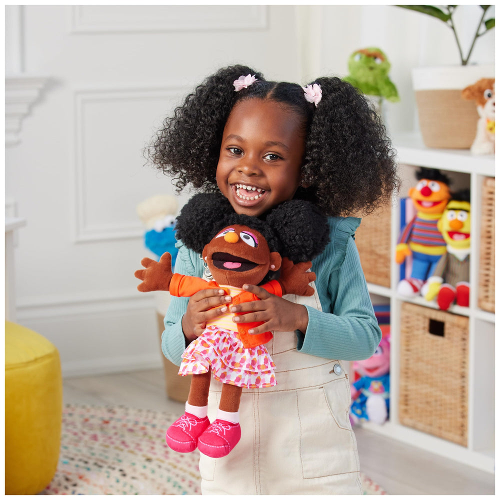 GUND Gabrielle striped top and colorful skirt create vibrant room decor.