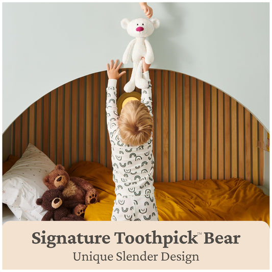 Toothpick confetti-pattern plush emphasizes slender silhouette for display and cuddles.