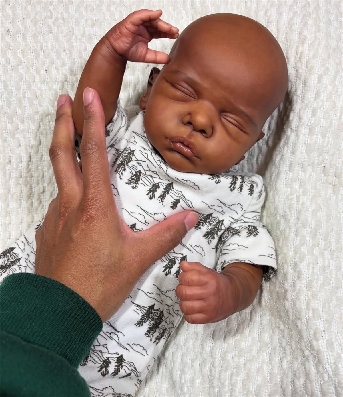 GYCV black reborn doll with included clothes set for dress-up play.