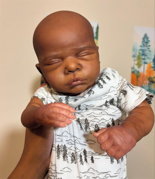 GYCV reborn black boy doll with magnetic pacifier for easy soothing.