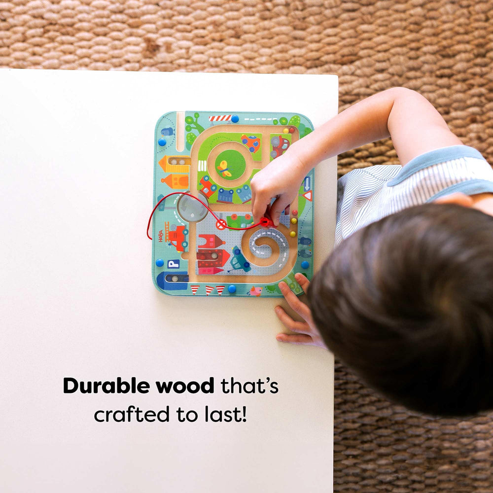 HABA Busy Board side storage keeps wand and components neatly within reach.