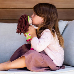 HABA Coco matching green headband completes toddler styling.