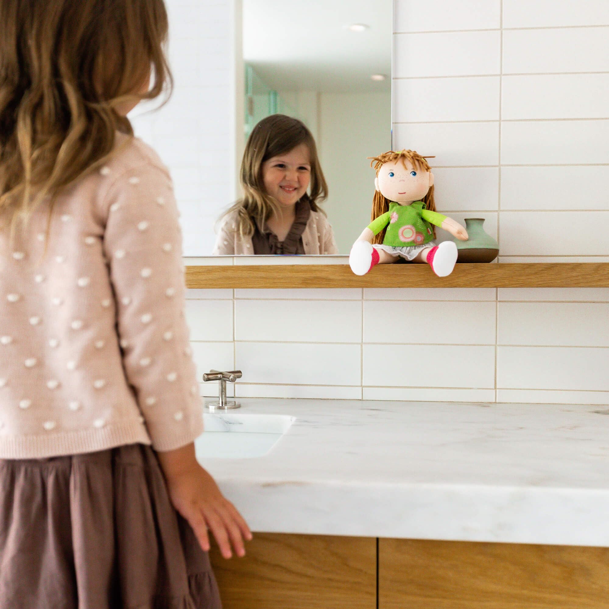 HABA Hedda grey skirt and sewn on pink shoes stay put during play