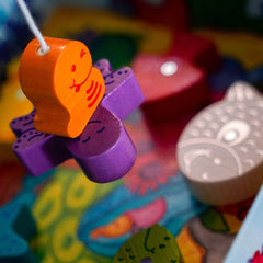 HABA Here Fishy Fishy magnetic fishing game dice-roll scene introduces simple rules.